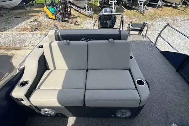 Slide: The Image of 2026 Barletta Cabrio 24UE pontoon boat with spacious seating and cup holders. - 16