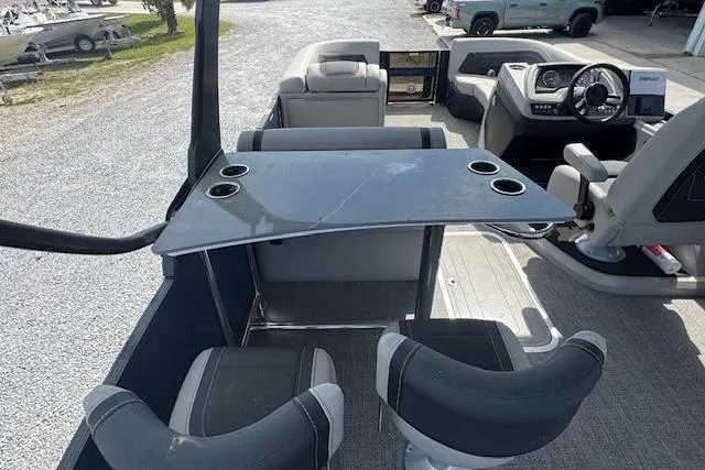 Slide: The Image of 2026 Barletta Cabrio 24UE pontoon boat interior with seating and control panel. - 17