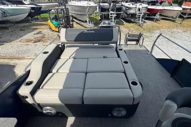 Slide: The Image of 2026 Barletta Cabrio 24UE pontoon boat with spacious seating and cup holders. - 19