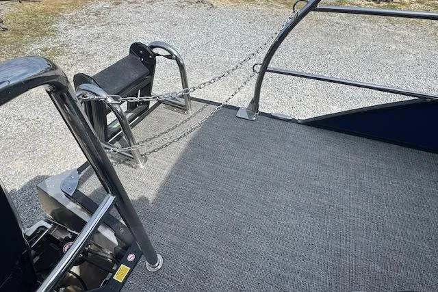 Slide: The Image of 2026 Barletta Cabrio 24UE boat deck with safety chains and railing. - 21