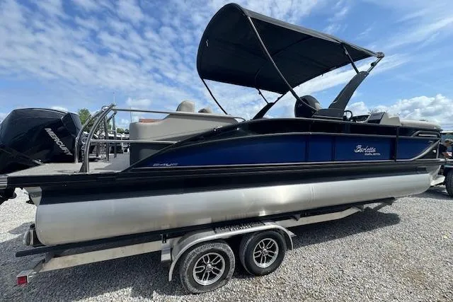Slide: The Image of 2026 Barletta Cabrio 24UE pontoon boat on trailer, featuring sleek design and canopy. - 3