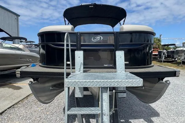 Slide: The Image of 2026 Barletta Cabrio 24UE pontoon boat with ladder, docked under a blue sky. - 9