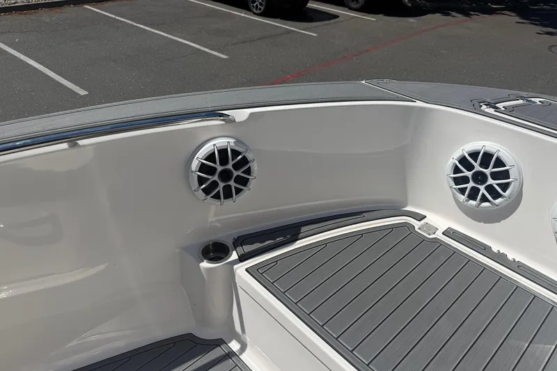 Slide: The Image of 2025 Robalo R180 Center Console boat interior with speakers and non-slip flooring. - 22