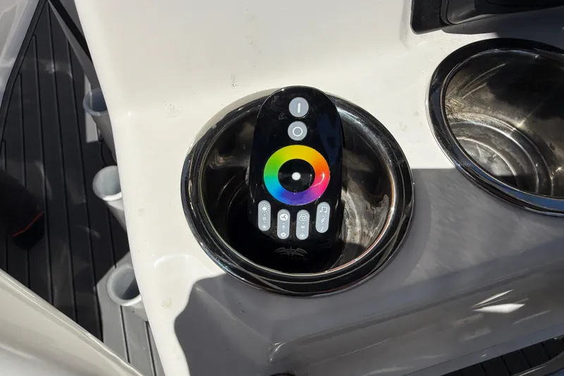 Slide: The Image of Remote control in cup holder on 2025 Robalo R180 Center Console boat. - 36