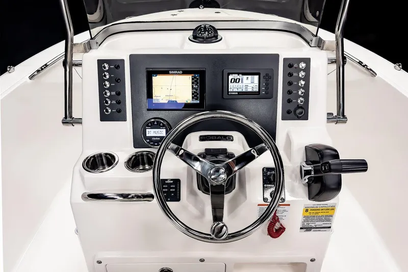 Slide: The Image of Manufacturer Provided Image: 2025 Robalo R180 Center Console dashboard with steering wheel and navigation controls. - 42