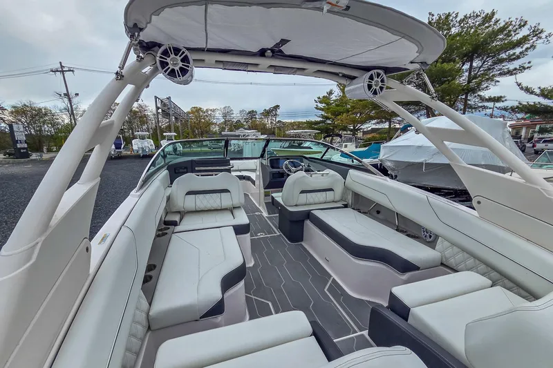 Slide: The Image of 2025 Regal LX4 boat interior with luxurious seating and modern design. - 14