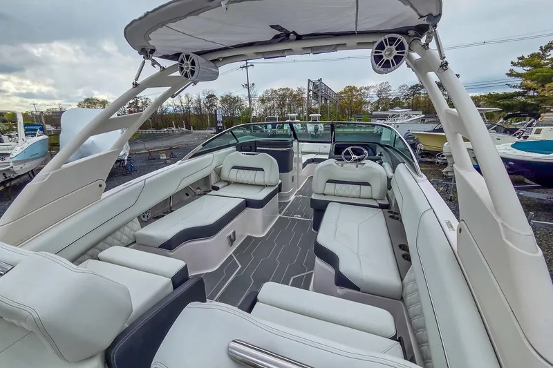 Slide: The Image of 2025 Regal LX4 boat interior with luxurious seating and modern design. - 16