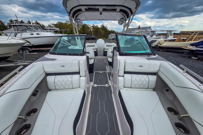 Slide: The Image of 2025 Regal LX4 boat interior with luxurious seating and modern design. - 26