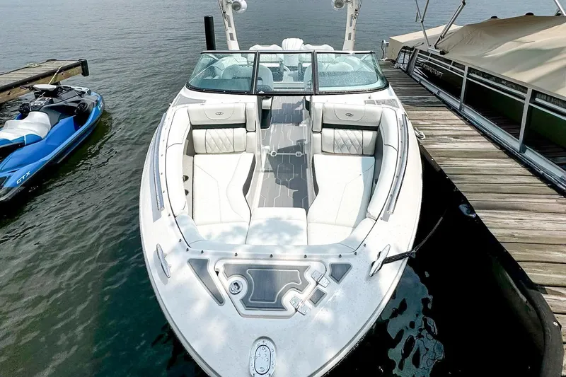 Slide: The Image of 2025 Regal LX4 boat with Yamaha engine on trailer, parked outdoors. - 5
