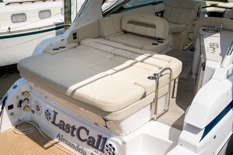Slide: The Image of The image shows the stern of a 2019 Regal 33 Express boat with beige upholstery. - 45
