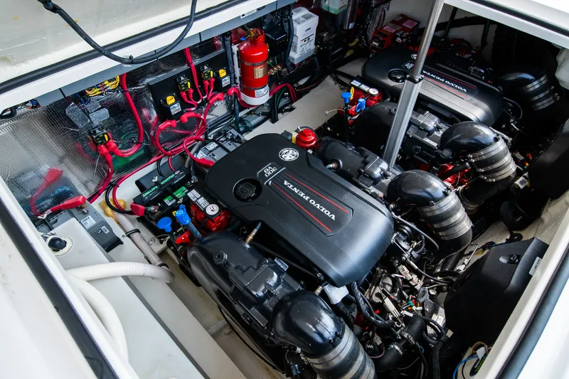 Slide: The Image of Engine room of a 2019 Regal 33 Express with twin Volvo Penta engines. - 49