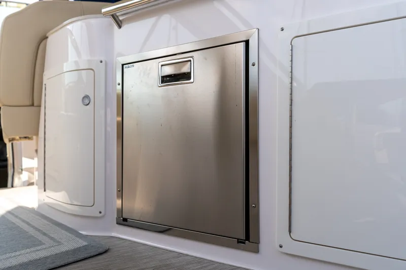 Slide: The Image of Stainless steel refrigerator on the 2019 Regal 33 Express boat. - 16