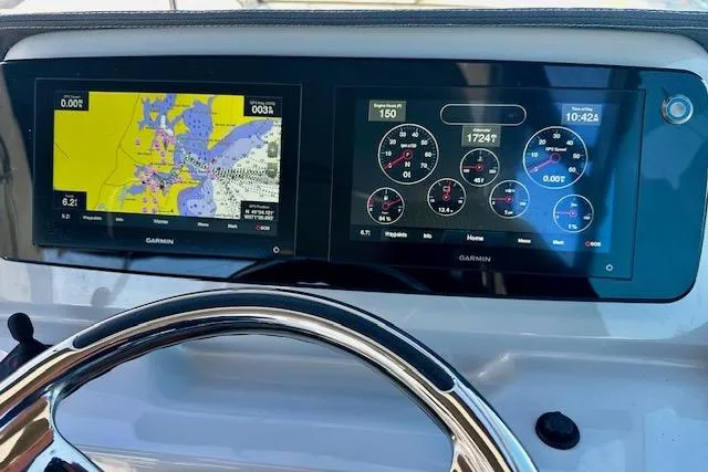 Slide: The Image of Dashboard of 2022 Regal 26 XO boat with Garmin navigation displays. - 15