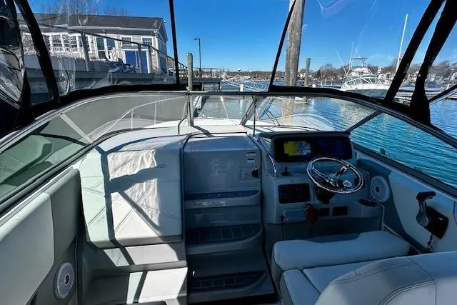 Slide: The Image of Interior view of a 2022 Regal 26 XO boat, featuring a sleek cockpit and modern controls. - 17