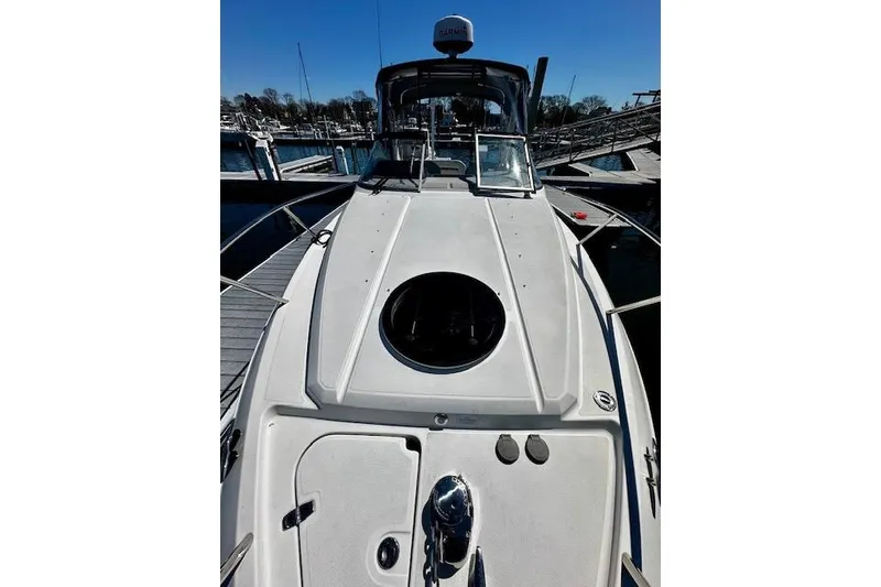 Slide: The Image of 2022 Regal 26 XO boat docked, showcasing sleek deck design and modern features. - 19