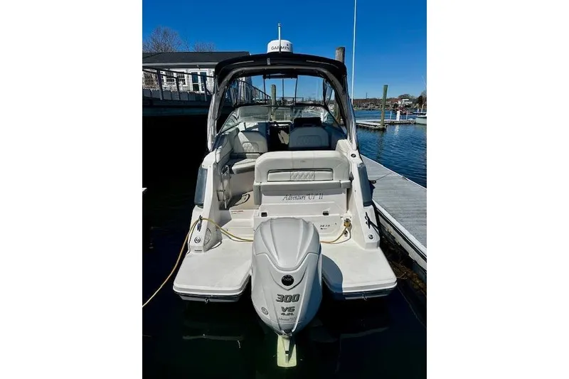 Slide: The Image of 2022 Regal 26 XO boat docked, featuring a powerful 300 V6 engine. - 2