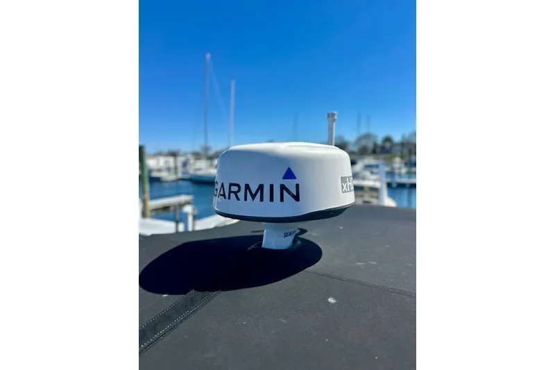 Slide: The Image of Garmin radar on 2022 Regal 26 XO boat, marina background, clear blue sky. - 20
