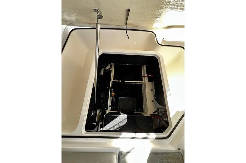 Slide: The Image of Open engine compartment of 2022 Regal 26 XO boat, showcasing interior components. - 26