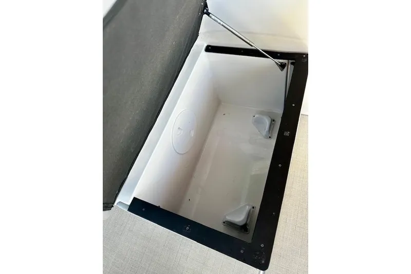 Slide: The Image of Open storage compartment in 2022 Regal 26 XO boat. - 27