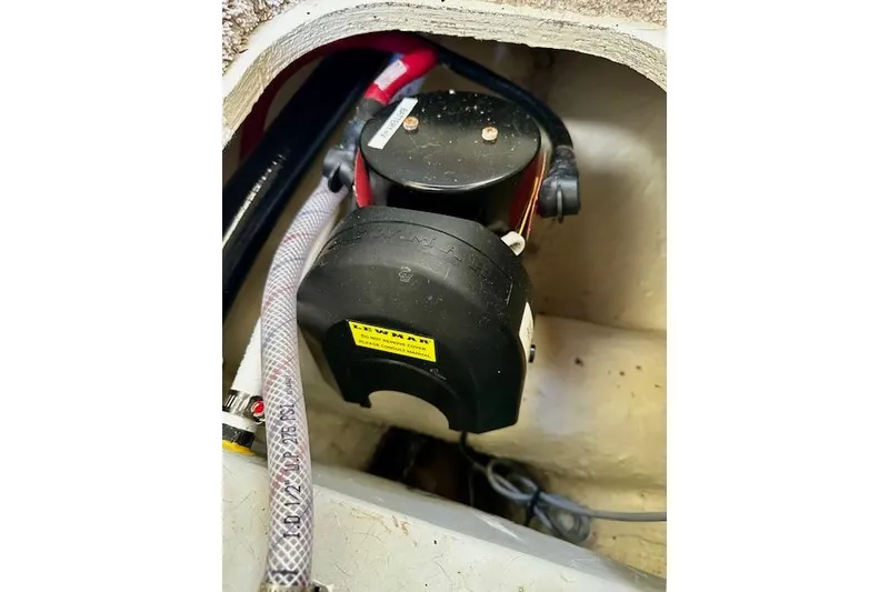 Slide: The Image of Boat engine compartment of 2022 Regal 26 XO with visible wiring and components. - 28