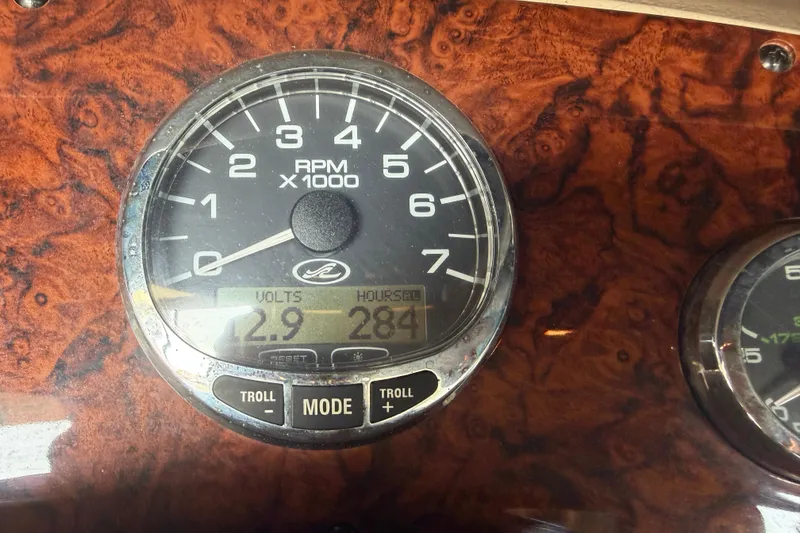 Slide: The Image of Close-up of 2005 Sea Ray Sundancer 280 RPM gauge displaying 2.9 volts and 284 hours. - 14