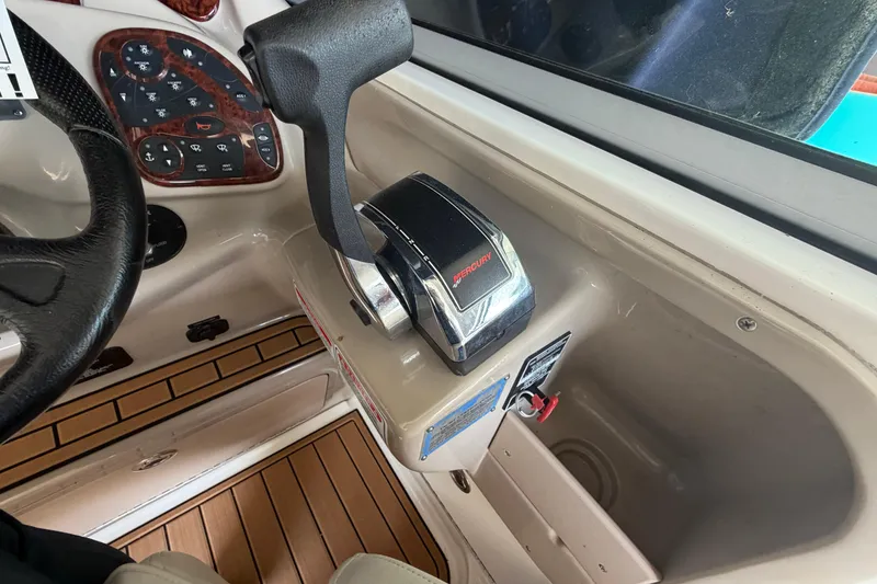 Slide: The Image of 2005 Sea Ray Sundancer 280 helm with Mercury throttle and control panel. - 18