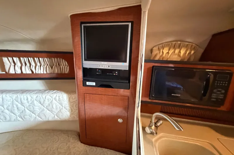 Slide: The Image of Interior of 2005 Sea Ray Sundancer 280 with TV, microwave, and sink. - 21