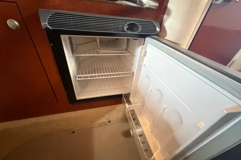 Slide: The Image of Open refrigerator inside 2005 Sea Ray Sundancer 280 boat cabin. - 25