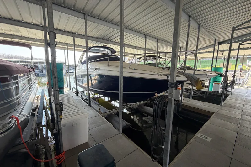 Slide: The Image of 2005 Sea Ray Sundancer 280 docked in a covered marina slip. - 3