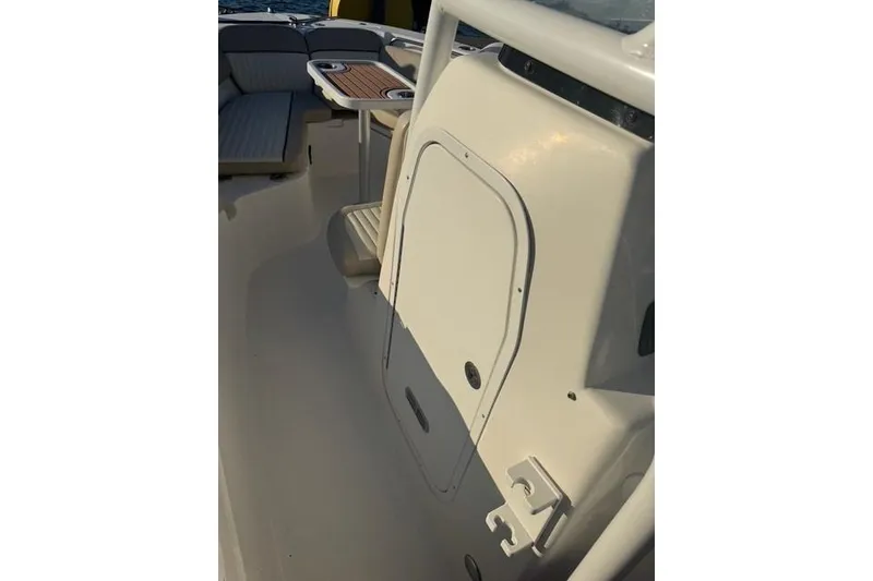 Slide: The Image of 2015 Sea Fox 249 Avenger boat interior with seating and storage compartment. - 10