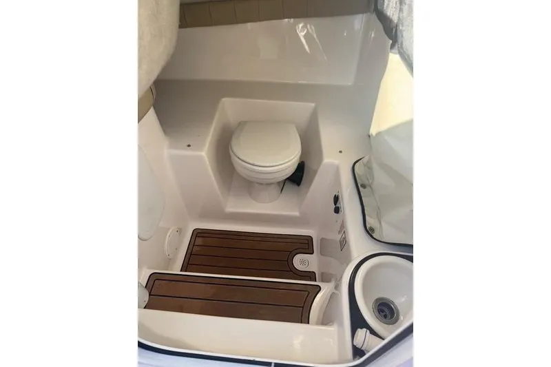 Slide: The Image of 2015 Sea Fox 249 Avenger boat interior with toilet and sink. - 11