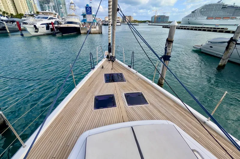 Slide: The Image of Bow view of 2019 Beneteau Oceanis Yacht 62 docked in a marina. - 20