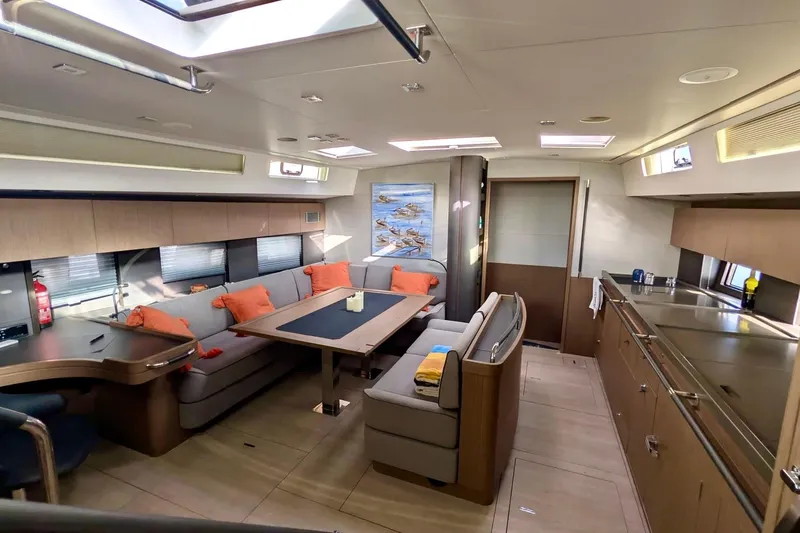 Slide: The Image of Luxurious interior of 2019 Beneteau Oceanis Yacht 62 with modern furnishings and ample natural light. - 23