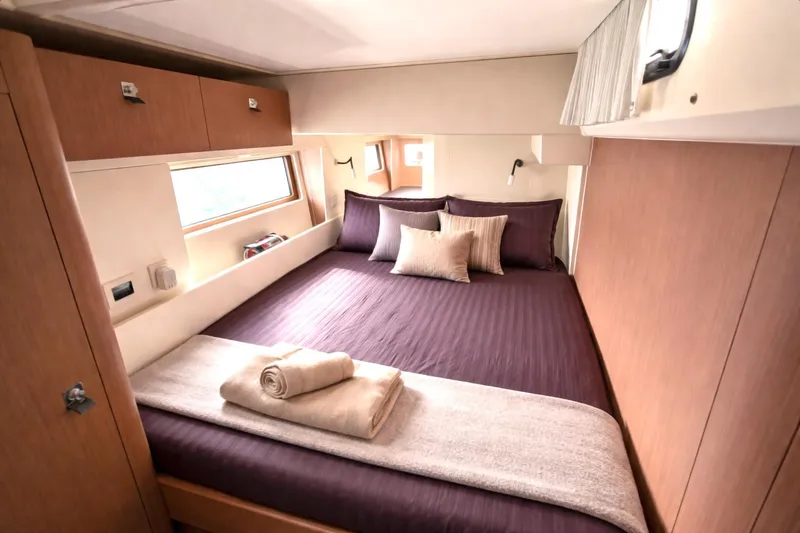 Slide: The Image of Luxurious cabin interior of 2019 Beneteau Oceanis Yacht 62 with elegant bedding. - 26