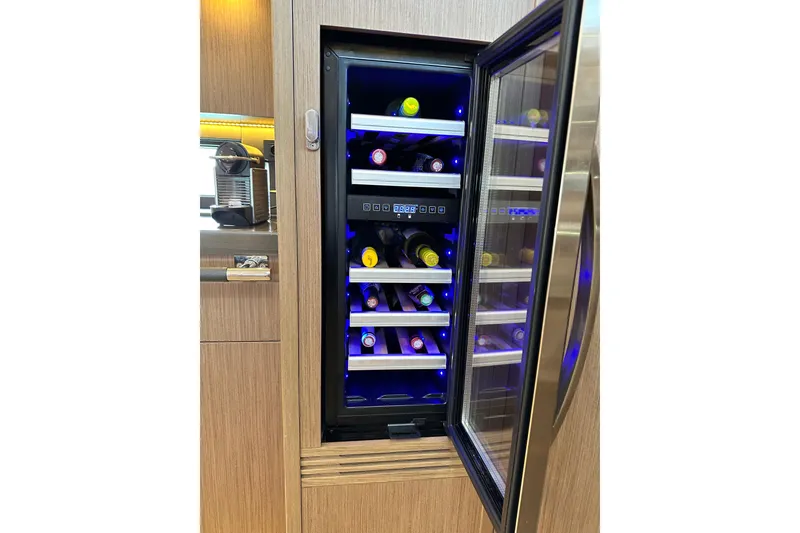 Slide: The Image of Wine cooler in 2019 Beneteau Oceanis Yacht 62, showcasing luxury interior design. - 30