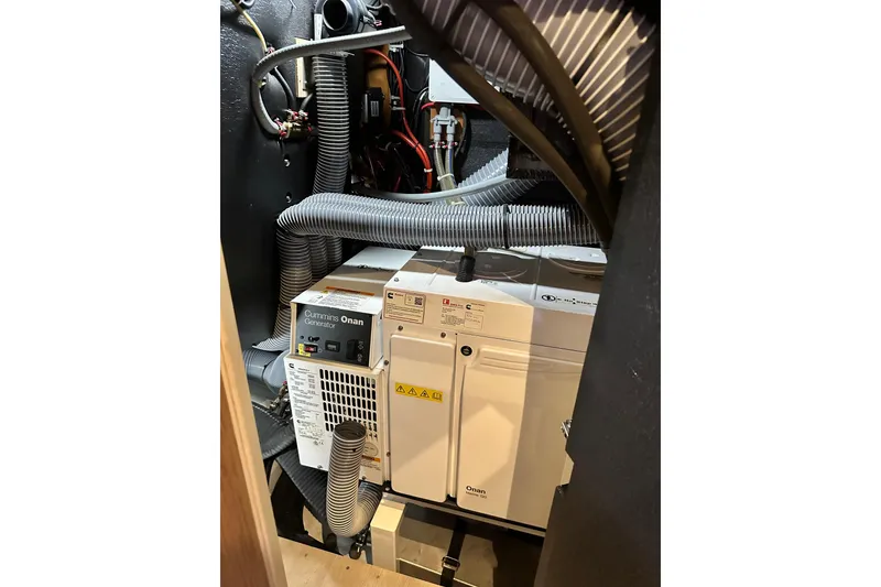 Slide: The Image of Cummins Onan generator in 2019 Beneteau Oceanis Yacht 62 engine room. - 32