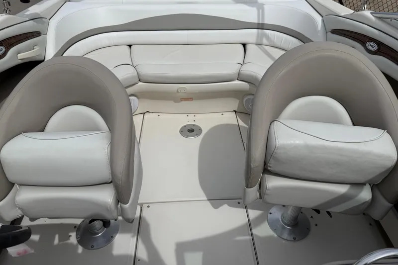 Slide: The Image of Interior of a 2003 Sea Ray 240 Bow Rider boat with beige seating. - 21