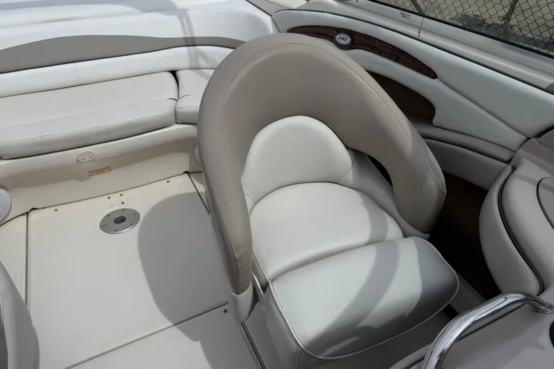 Slide: The Image of 2003 Sea Ray 240 Bow Rider interior with plush seating and elegant design. - 24