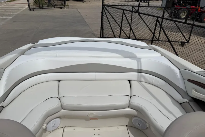 Slide: The Image of Interior view of a 2003 Sea Ray 240 Bow Rider boat with white seating. - 28
