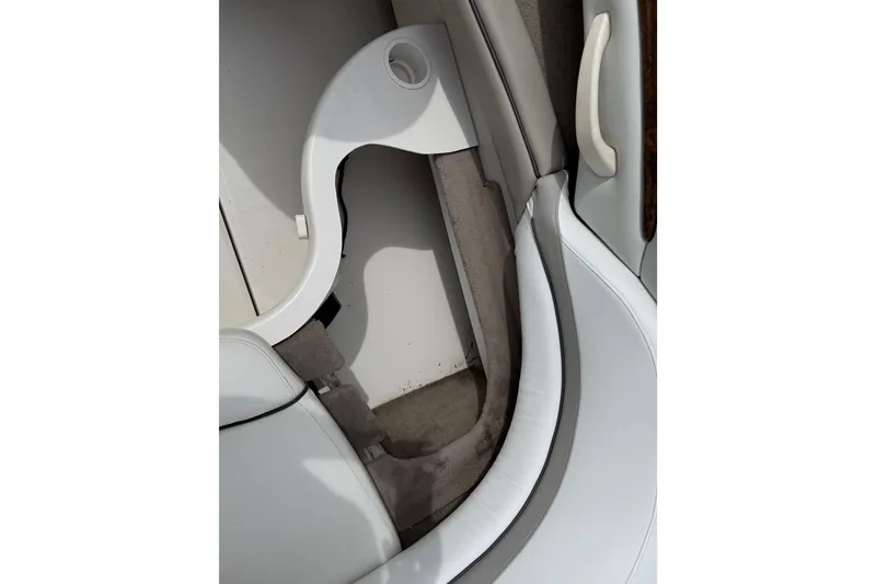 Slide: The Image of Interior view of a 2003 Sea Ray 240 Bow Rider boat, featuring seating and storage. - 35
