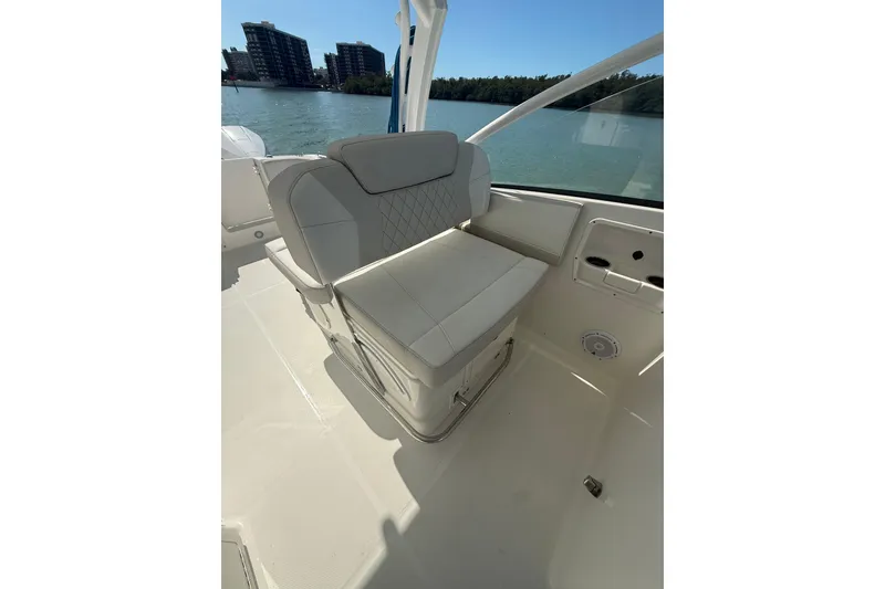 Slide: The Image of 2025 World Cat 280 DC-X boat seat with waterfront view. - 11