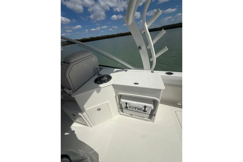 Slide: The Image of 2025 World Cat 280 DC-X boat interior with seating, storage, and rod holders. - 12