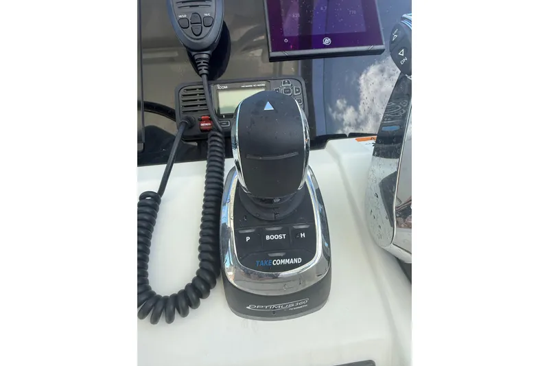 Slide: The Image of Control panel of 2025 World Cat 280 DC-X boat with joystick and communication equipment. - 6