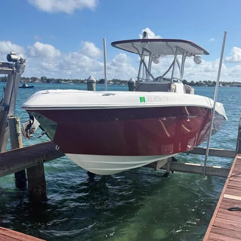 The Image of 2015 Deep Impact 33 boat docked on a sunny day, showcasing sleek design and vibrant colors. - 0