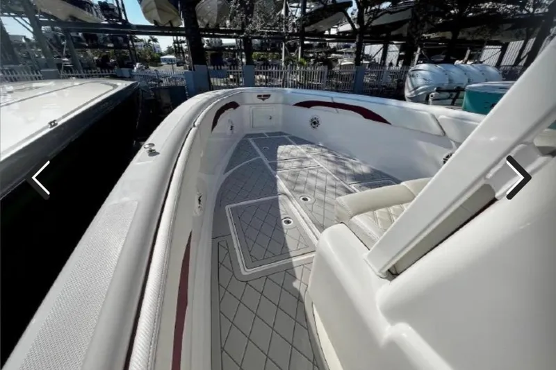 Slide: The Image of 2015 Deep Impact 33 boat interior with sleek seating and modern design. - 14