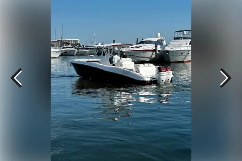 Slide: The Image of 2015 Deep Impact 33 boat in marina, surrounded by yachts on a sunny day. - 6