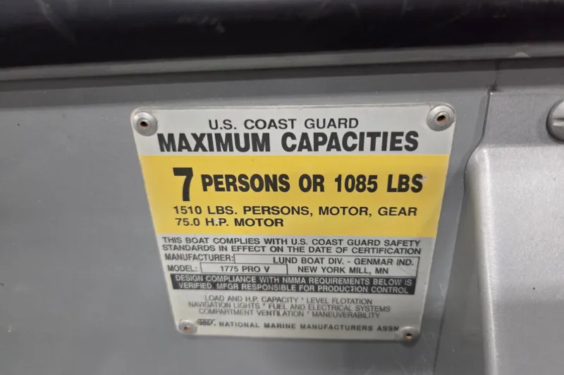 Slide: The Image of U.S. Coast Guard capacity label for 1995 Lund 1775 Pro-V SE boat, 7 persons or 1085 lbs. - 13
