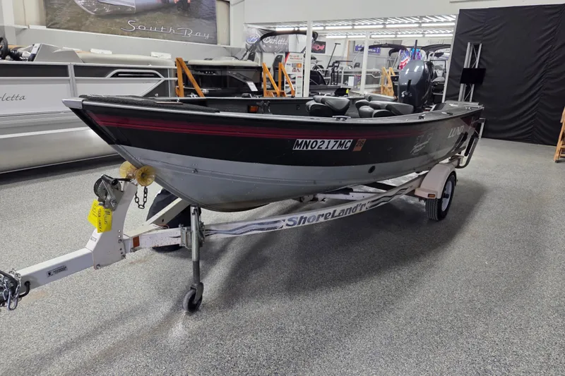 Slide: The Image of 1995 Lund 1775 Pro-V SE fishing boat on ShoreLand'r trailer in showroom. - 4