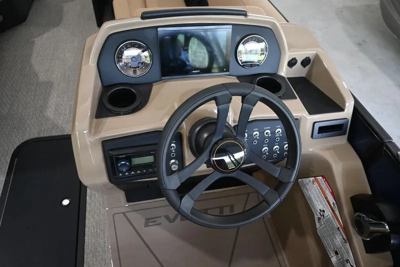 Slide: The Image of 2026 Evotti 523QL boat dashboard with steering wheel and control panel. - 13