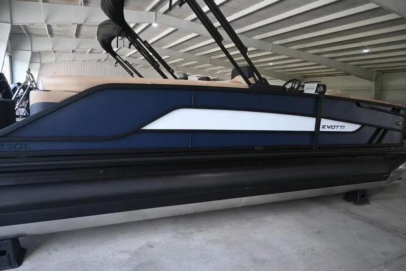 Slide: The Image of 2026 Evotti 523QL pontoon boat in a storage facility, side view. - 3